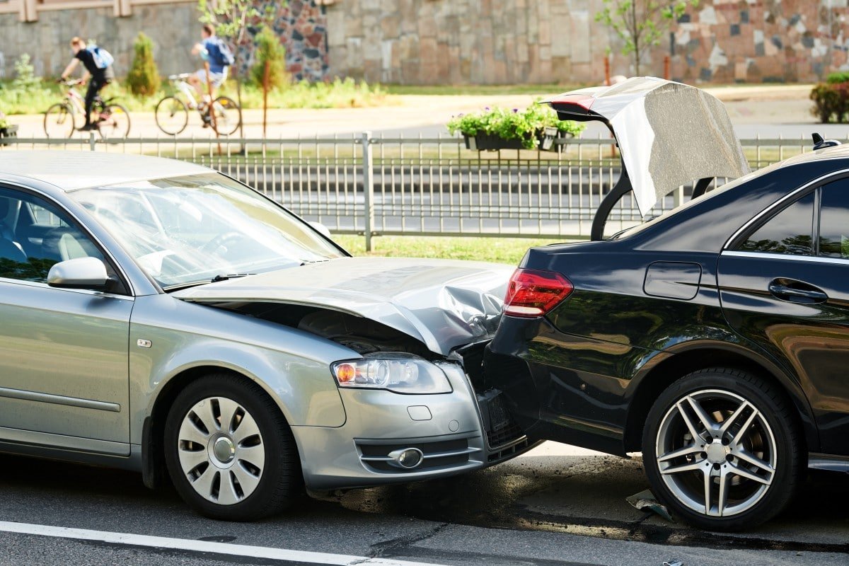 a silver sedan driving on a sunny road, representing the comprehensive auto insurance coverage offered by Insurance Company Westerville Ohio to protect vehicles and drivers from unexpected incidents.