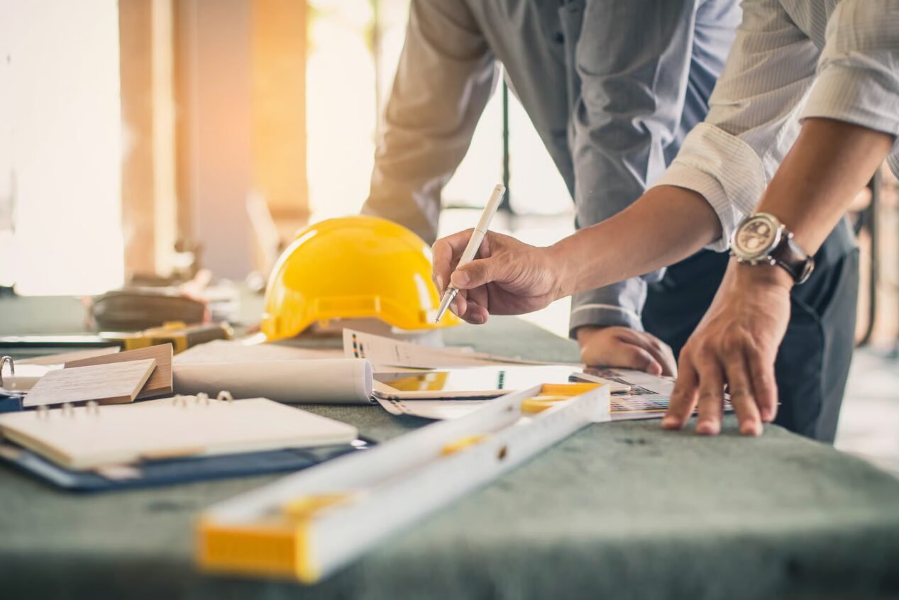 a confident general contractor reviewing insurance policy documents, representing comprehensive general contractor insurance services provided by Insurance Company Westerville Ohio LLC.