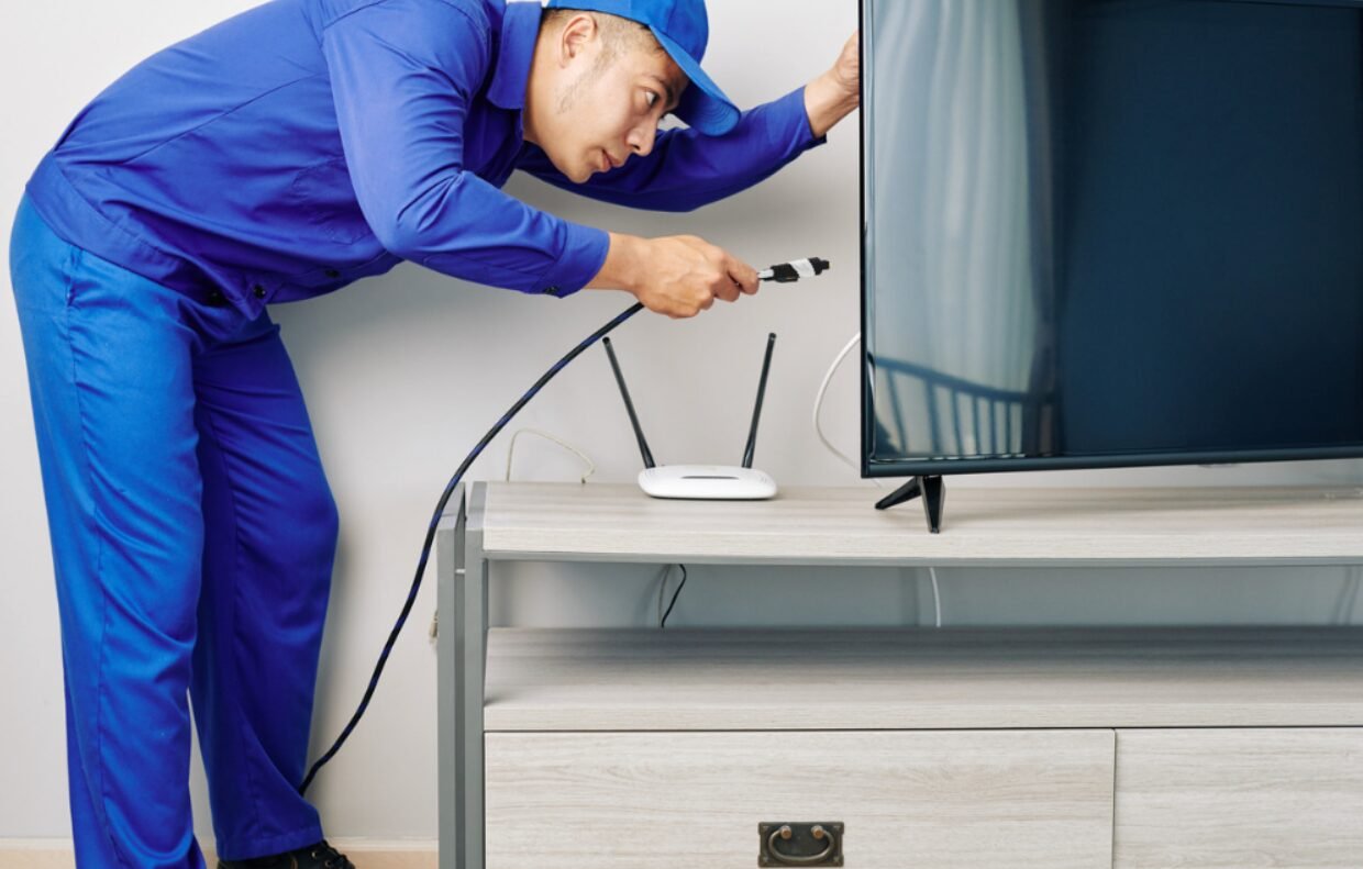 Professional cable installer equipped with safety gear expertly handling installation tasks, representing reliable and comprehensive insurance coverage in Westerville, Ohio